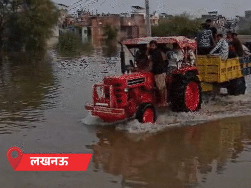 लखीमपुर में मकान नदी में समाया, बाढ़ में फंसा बाघ:लखनऊ में घर-दुकान जलमग्न, सड़कों पर नाव चल रही; यूपी में मानसून विदा